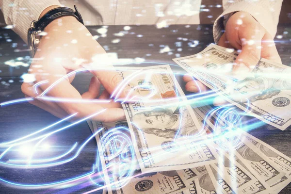 Multi exposure of Tech taxi drawing hologram and USA dollars bills and man hands. Technology concept.