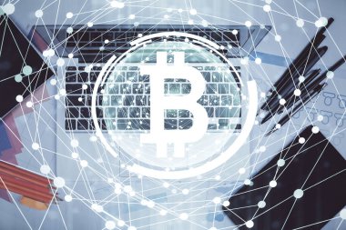 Masaüstü arkaplanındaki bilgisayarın üzerinden engelleme temalı hologram çizimleri. Üst Manzara. Çoklu maruz kalma. Kripto ekonomi kavramı.