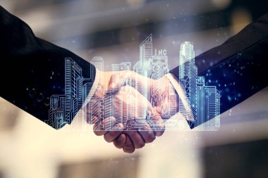 Şehrin iki kez görüntülenmesi hologramı ve iki adamın el sıkışması. İnşaat yönetimi.