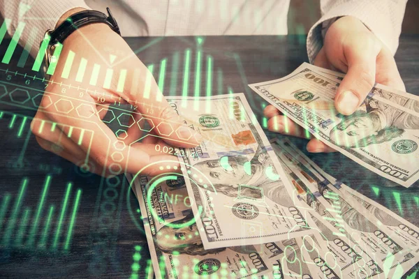 Multi exposure of Tech drawing hologram and USA dollars bills and man hands. Technology concept.