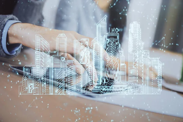 Double exposure of town hologram and man and woman working together holding and using a mobile device. Smart city concept.