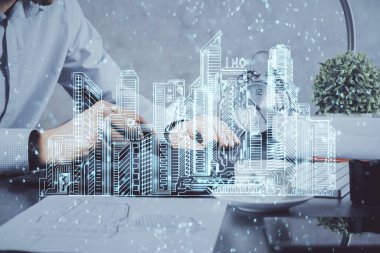 Dijital bir cihaz ve şehir çizimi kullanarak insanın ellerini tutarken çift pozlama.