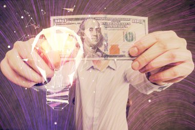 Ampulün hologram çizimi, Amerikan doları banknotları ve insan eli. İş Fikri konsepti.