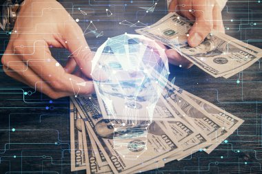 Ampulün hologram çizimi, Amerikan doları banknotları ve insan eli. İş Fikri konsepti.