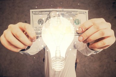 Ampulün hologram çizimi, Amerikan doları banknotları ve insan eli. İş Fikri konsepti.