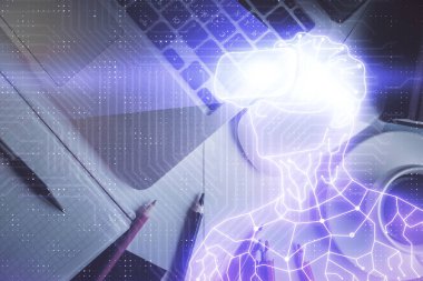 AR hologram çizimleri masaüstü arka planında bilgisayarın üzerinde. Üst Manzara. Çoklu maruz kalma. Artırılmış gerçeklik kavramı.