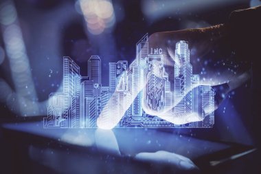 Dijital bir cihaz ve şehir çizimi kullanarak insanın ellerini tutarken çift pozlama.