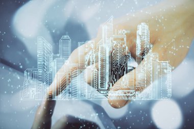 Dijital bir cihaz ve şehir çizimi kullanarak insanın ellerini tutarken çift pozlama.