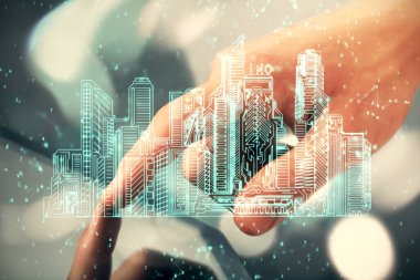 Dijital bir cihaz ve şehir çizimi kullanarak insanın ellerini tutarken çift pozlama.