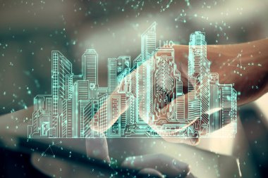 Dijital bir cihaz ve şehir çizimi kullanarak insanın ellerini tutarken çift pozlama.