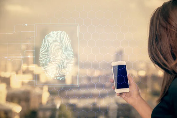 Double exposure of fingerprint hologram and woman holding and using a mobile device. Security concept.