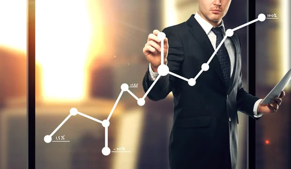 Businessman drawing graph — Stock Photo, Image