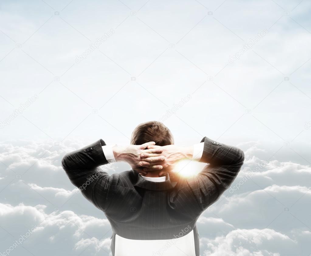 man looking at cloud
