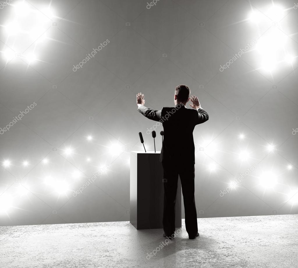 businessman standing on podium