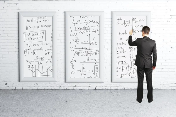 Businessman drawing  formulas — Stock Photo, Image