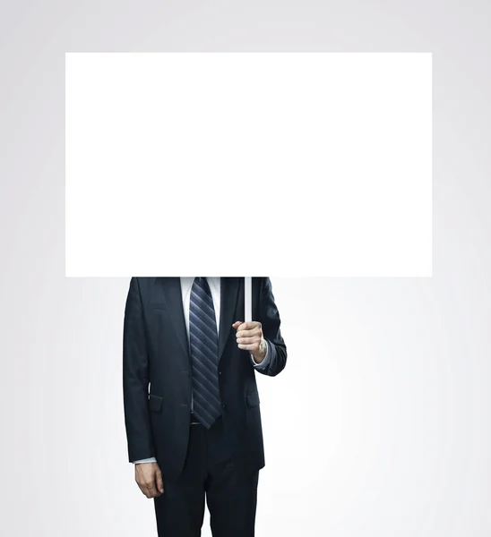 Businessman holding card — Stock Photo, Image