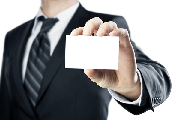 Businessman handing a blank business card