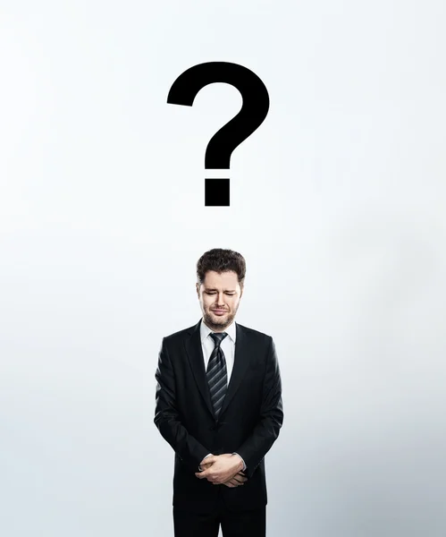 Man with questions symbol — Stock Photo, Image