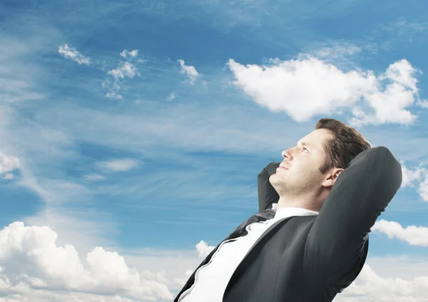 Businessman sitting and dreaming on travel — Stock Photo, Image