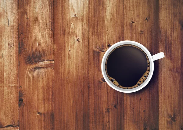 Kaffekopp på träbord, närbild — Stockfoto