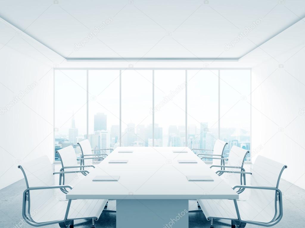 white office interior with table and chairs