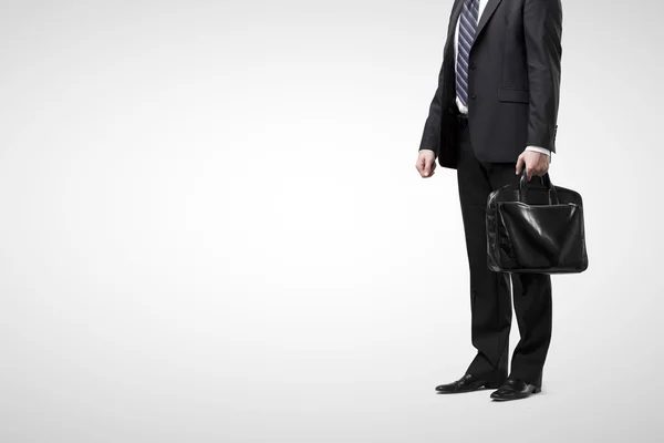 Businessman in suit with black briefcase — Stock Photo, Image