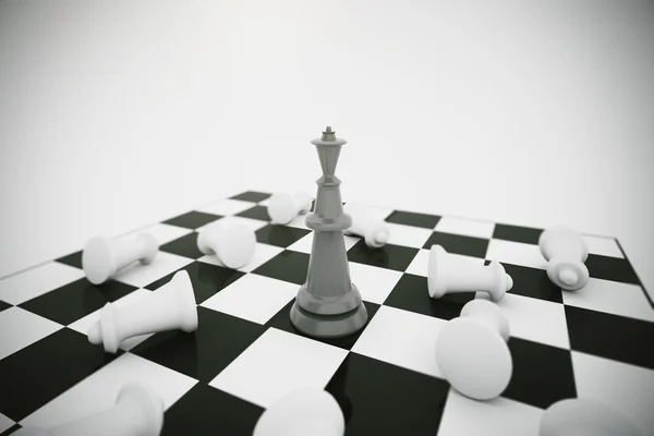 Černý král a bílé šachové figurky poražení — Stock fotografie