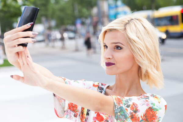 Young woman talking a selfie