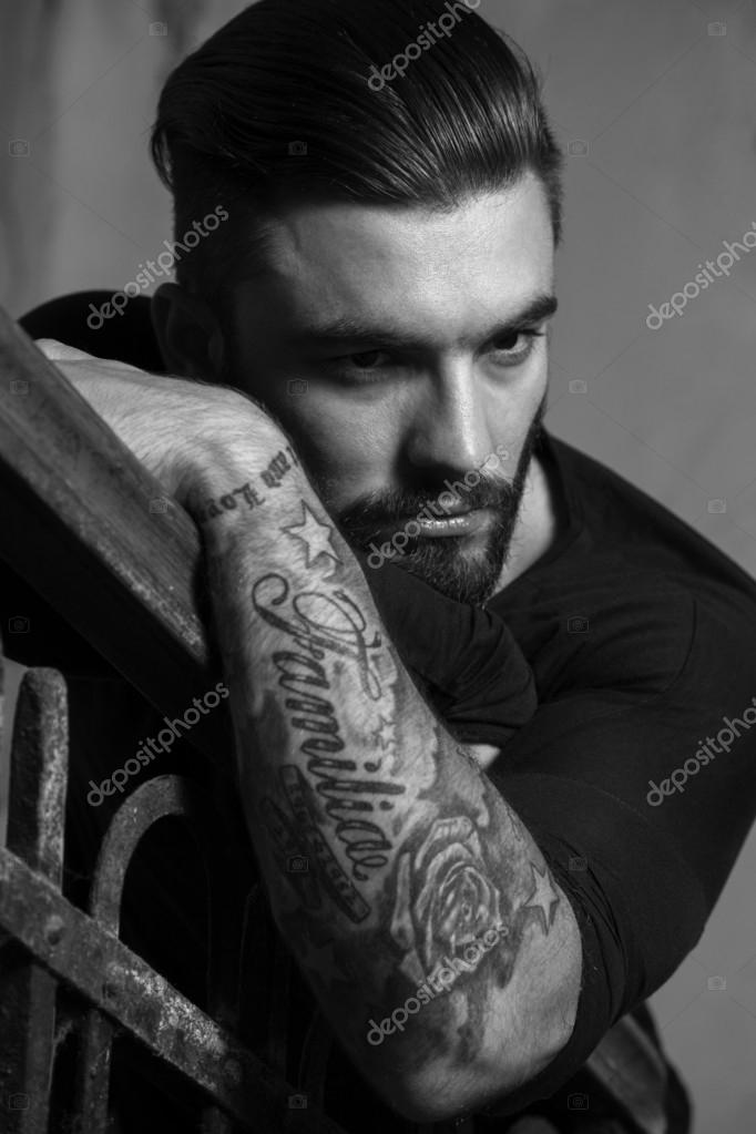 Young man with tattoos — Stock Photo © patrisyu #73845937