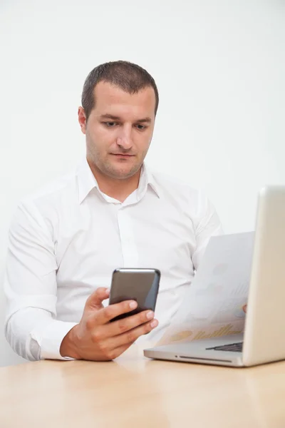 Young man Using tablet and mobile phone — Stock Photo, Image