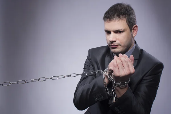 His hands are in chains — Stock Photo, Image