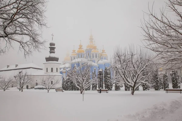 Michael\'s Golden Domed Cathedral in winter snowfall. Kiev.  Ukraine