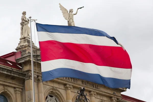 Costa Rican flag and National Theater Royalty Free Stock Images