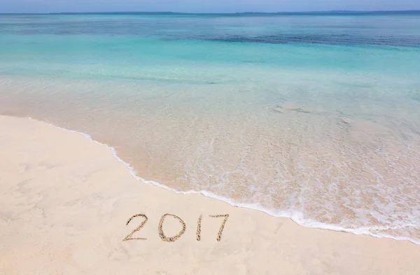 Jahr 2017 am Sandstrand lizenzfreie Stockfotos