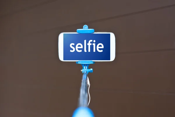 Selfie stick with mobile — Stock Photo, Image