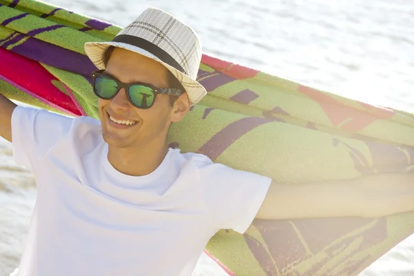Young man on the beach — Stock Photo, Image