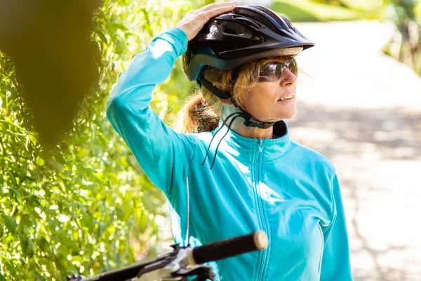 cyclist woman with helmet and mountain bike