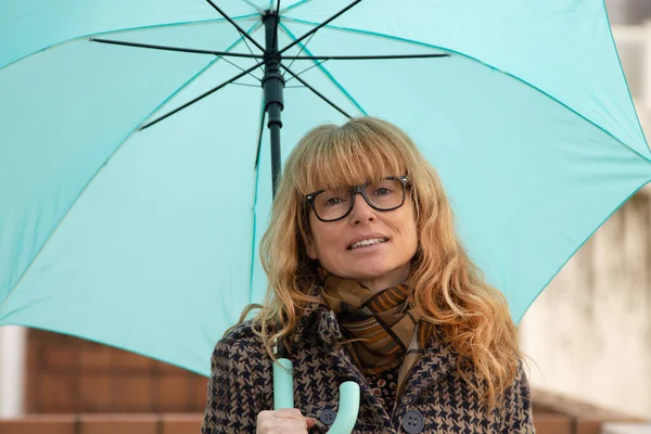 woman with umbrella on the street outdoors