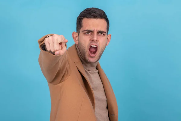 man screaming and pointing furious isolated on background