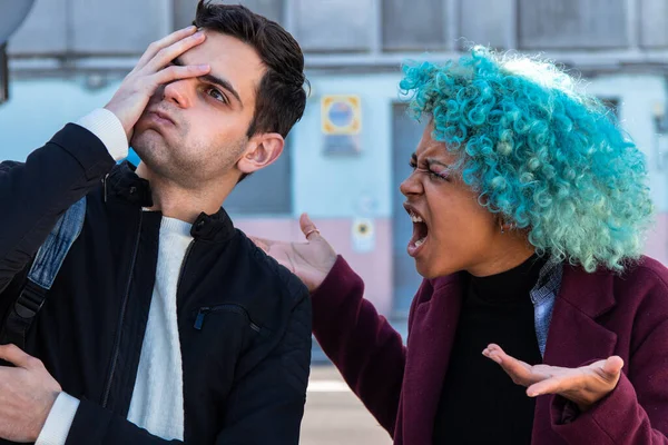 couple arguing or fighting in the street