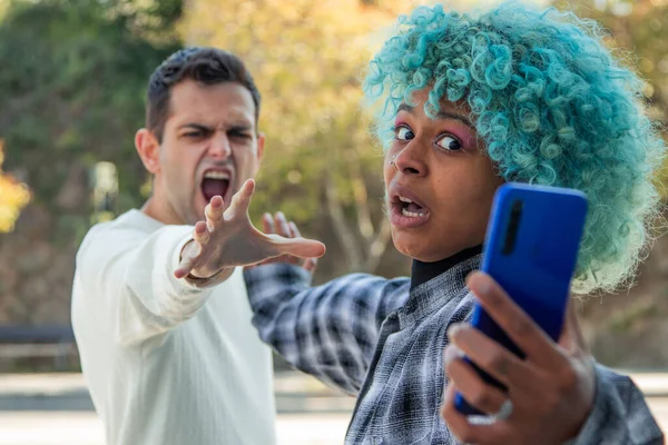 couple fighting over the mobile phone