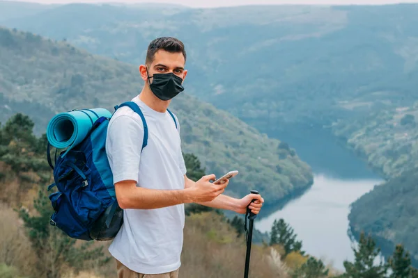 Young Man Protected Mask Hiking Mountains Mobile Phone — Fotografia de Stock