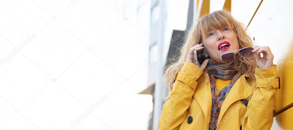 woman talking mobile phone on street