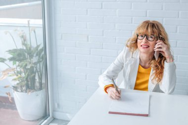 business woman in office working with mobile phone