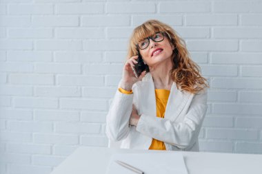 business woman in office working with mobile phone