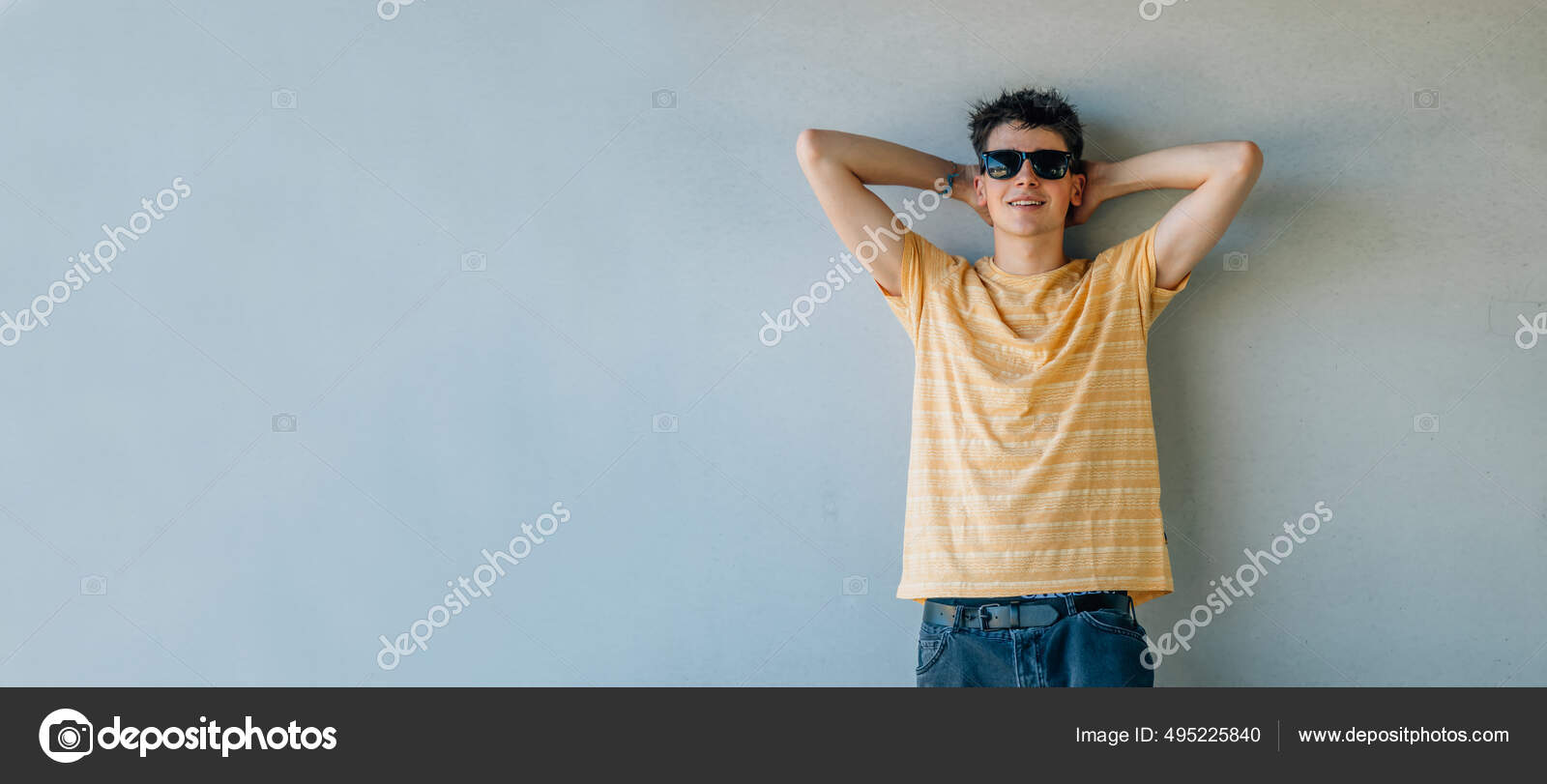 Relaxed Teen Boy Sunglasses Leaning Wall Stock Photo by ©carballo 495225840