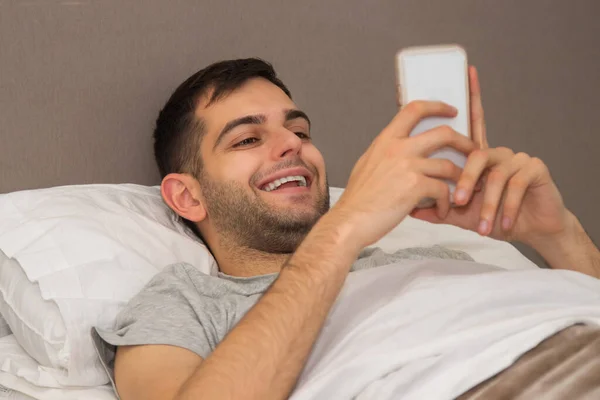 Man Bed Looking Mobile Phone — Stock Photo, Image