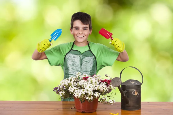 Child with garden plants — Stock Photo, Image