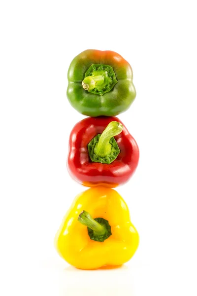 Red, green and yellow sweet bell peppers — Stock Photo, Image
