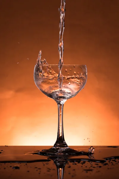 Water splash in a glass — Stock Photo, Image